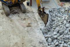 demolition-excavator-with-hydraulic-jack-hammer-is-destroying-concrete-slab_44576-71